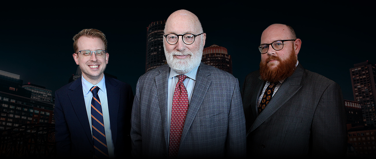 J. W. “Jay” Carney Jr, Daniel J. Gaudet and Nat Carney with the Boston Skyline Night in the background