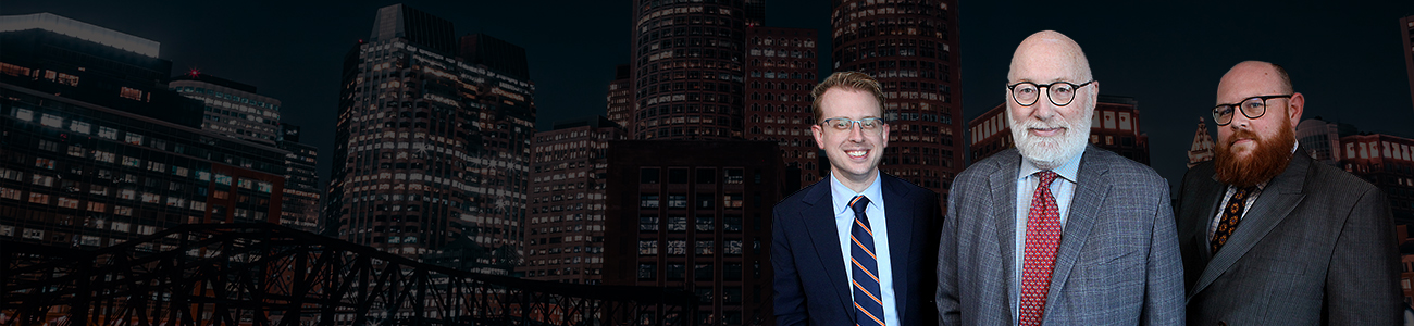J. W. “Jay” Carney Jr, Daniel J. Gaudet and Nat Carney with the Boston Skyline Night in the background